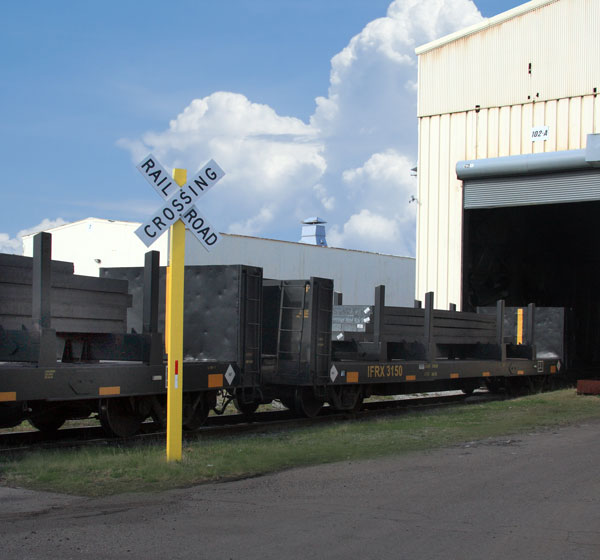Railcar hauling steel entering warehouse
